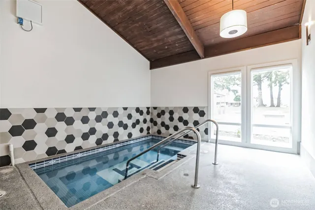 a view of a swimming pool with a porch