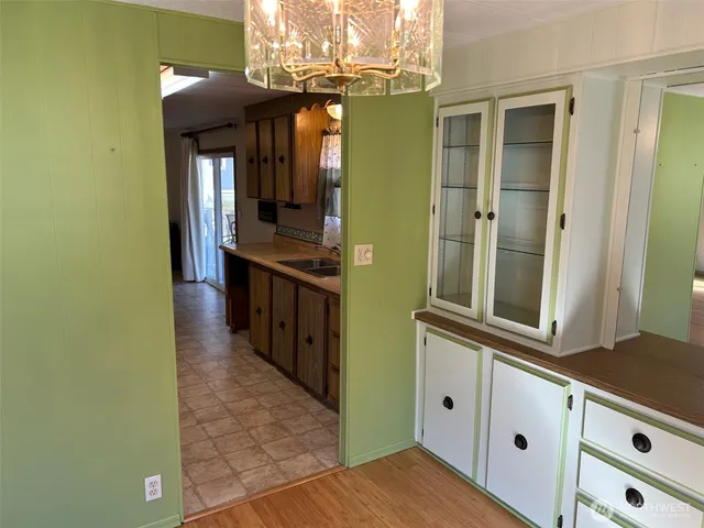 a kitchen with stainless steel appliances granite countertop a refrigerator and a stove