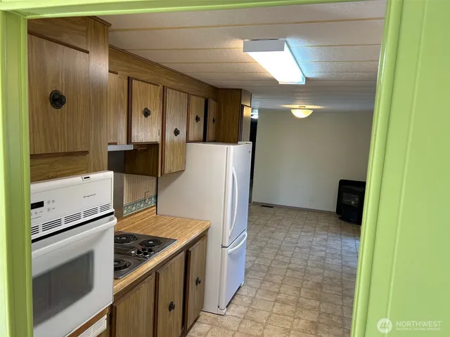 a kitchen with stainless steel appliances a refrigerator and a sink