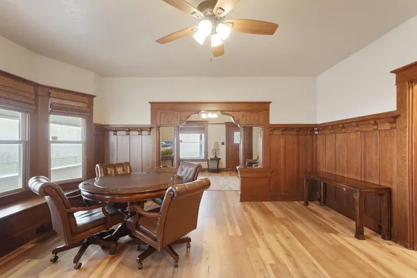 a dining room with furniture and window