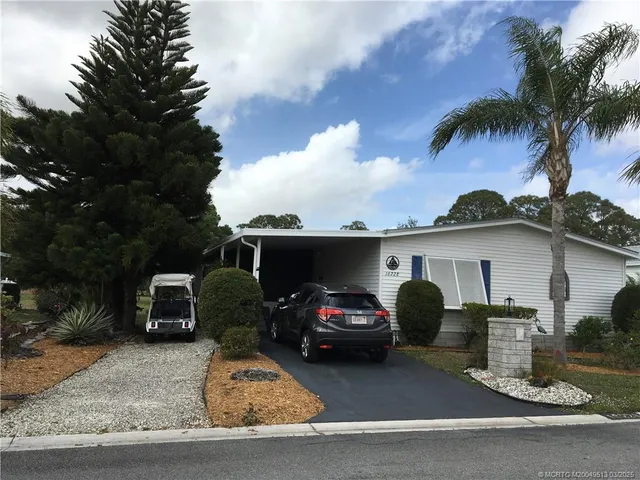 a view of a car parked in front of a house