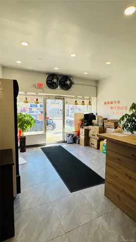 a kitchen with stainless steel appliances kitchen island granite countertop a refrigerator and stove