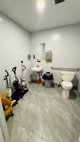 a living room with furniture a rug and a table