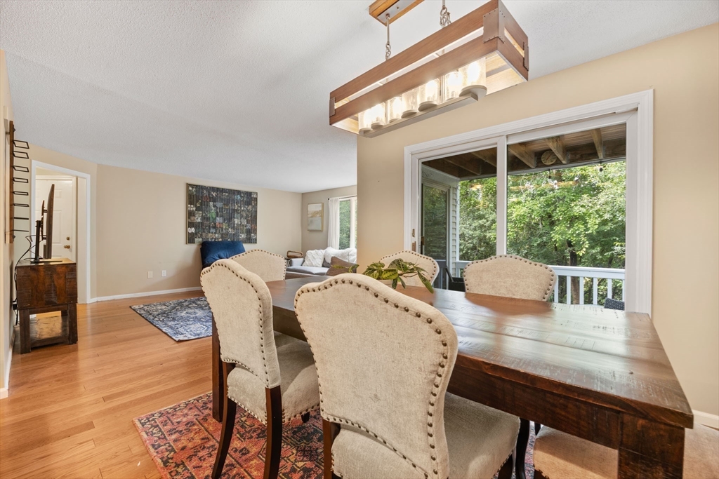 120 Abington Road, Unit 120 Danvers, MA 01923 - Photo 11 of 31 a view of a dining room with furniture window and wooden floor