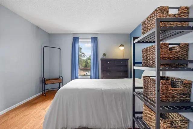 a bedroom with a bed and a dresser