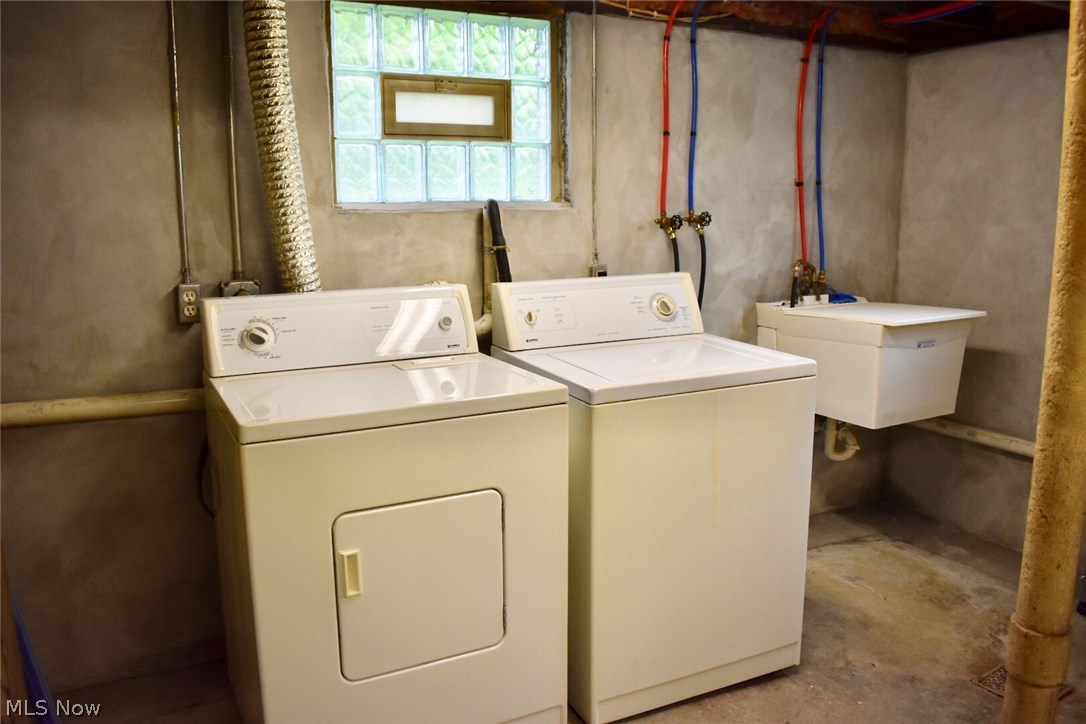 1246 Deforest Road Southeast Warren, OH 44484 - Photo 21 of 26 The basement houses the washer & dryer that is included and the utility sink.