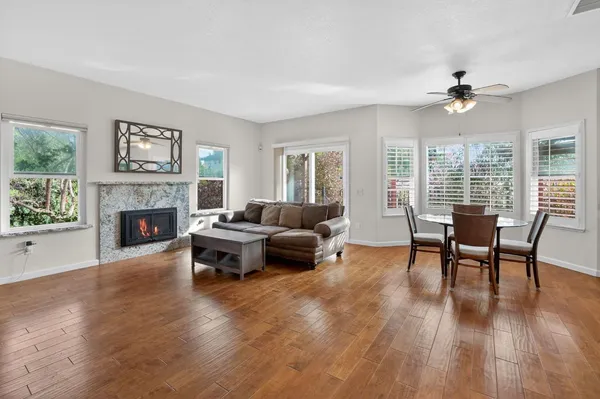 a living room with furniture fireplace and window