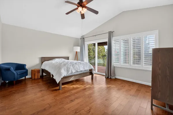 a bedroom with a bed and a chair