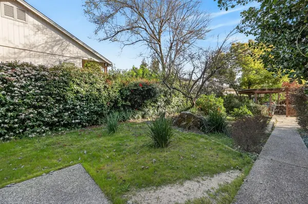 a backyard of a house with lots of green space