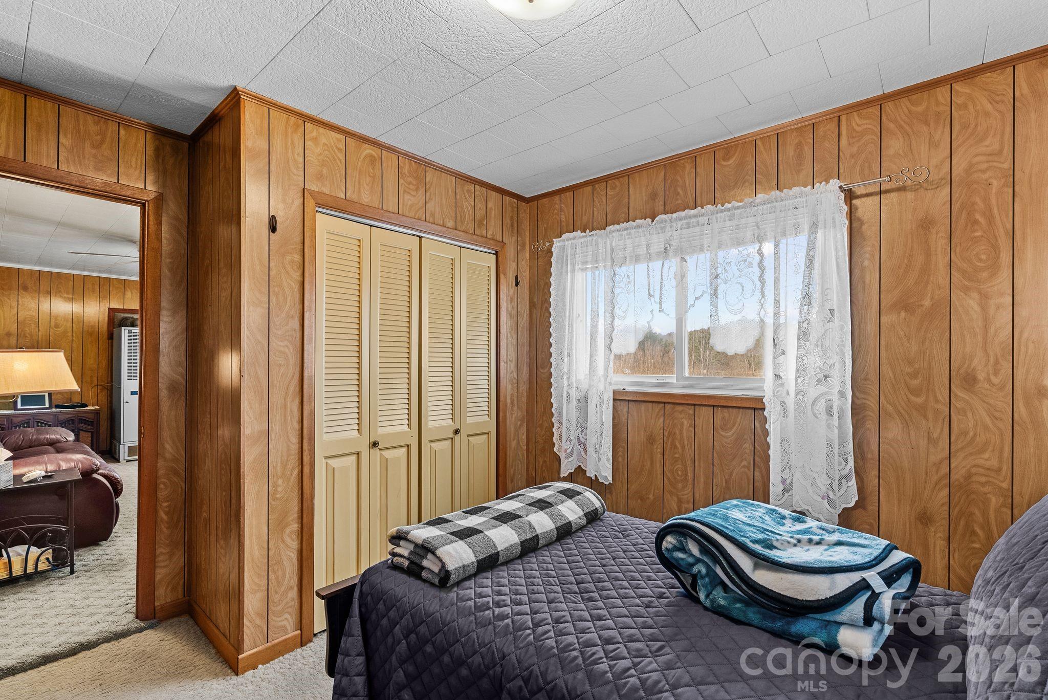 148 Monteith Road Brevard, NC 28712 - Photo 14 of 39 a bedroom with a bed and a window