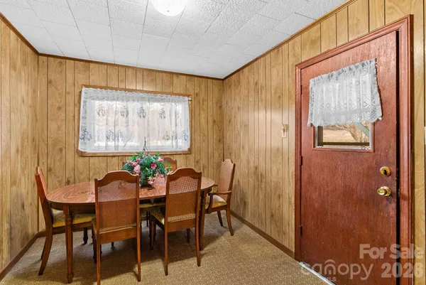 a kitchen that has a lot of cabinets a sink and a stove in it