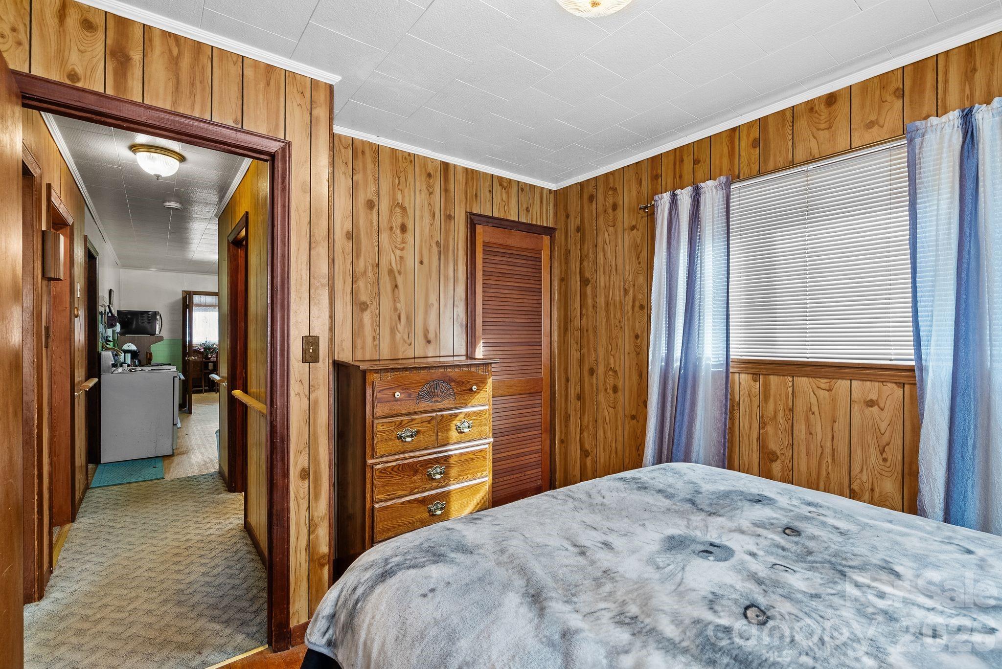 148 Monteith Road Brevard, NC 28712 - Photo 21 of 39 a bedroom with a bed and a dresser