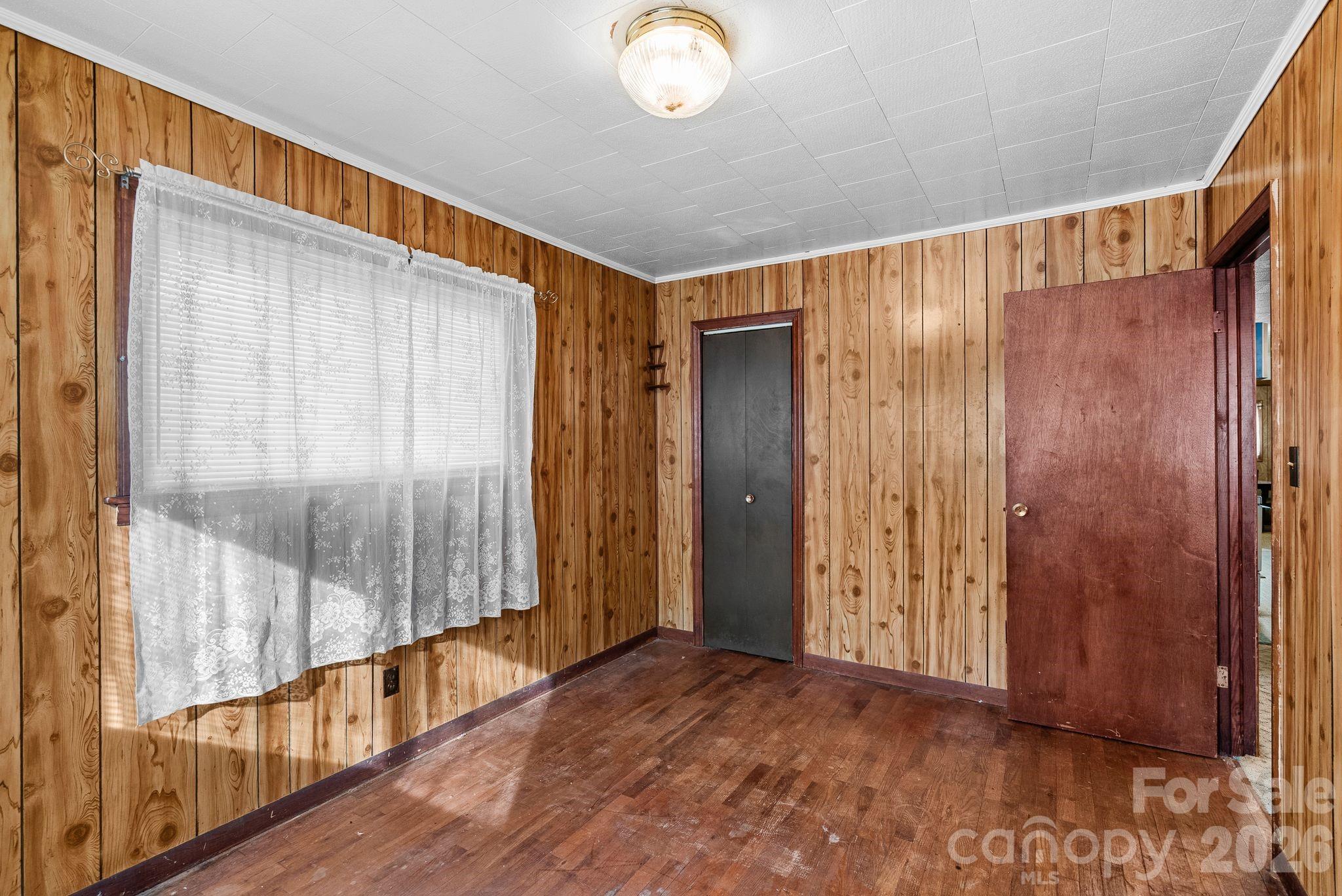 148 Monteith Road Brevard, NC 28712 - Photo 23 of 39 a view of a hallway with wooden floor and windows