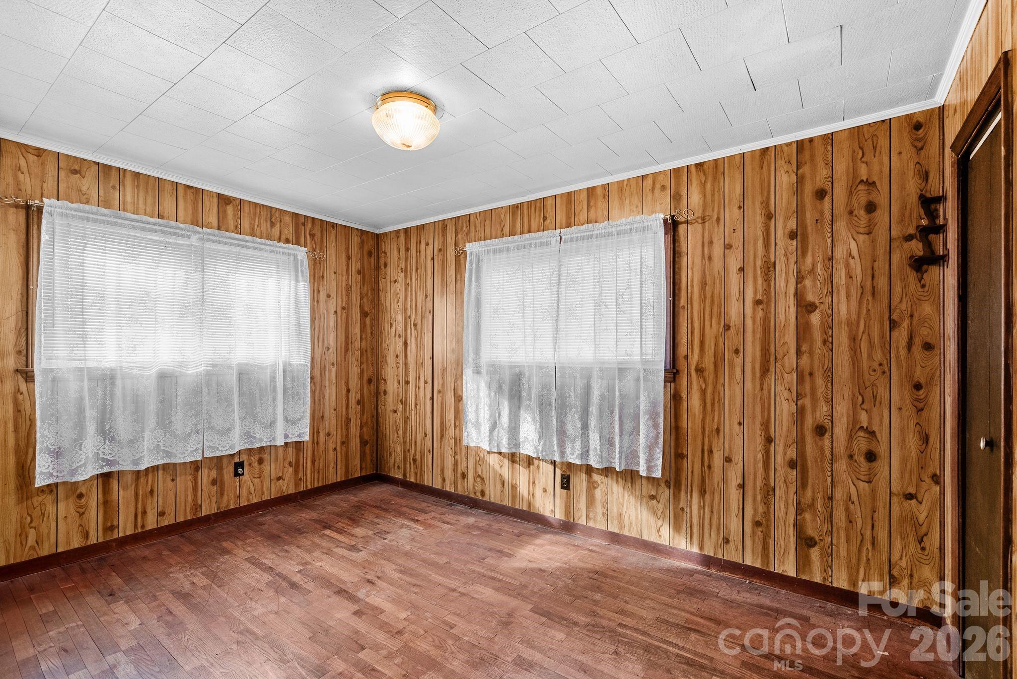 148 Monteith Road Brevard, NC 28712 - Photo 24 of 39 a view of an empty room with wooden floor and a window