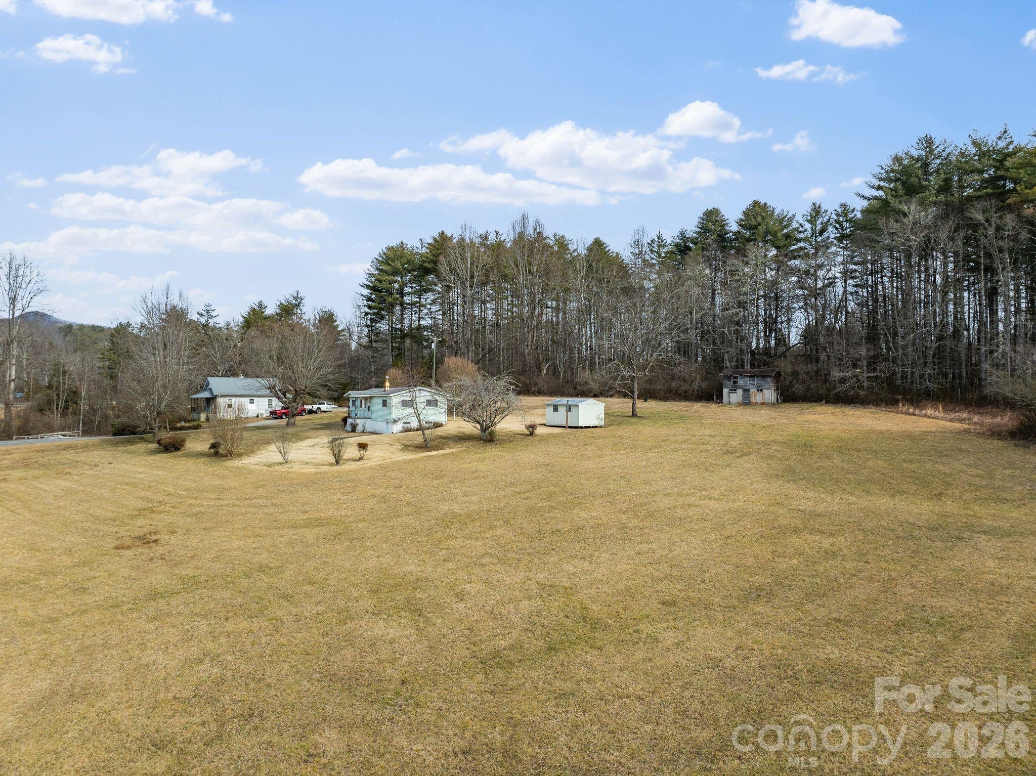 148 Monteith Road Brevard, NC 28712 - Photo 32 of 39 a view of outdoor space with swimming pool and trees