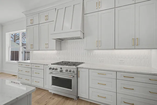 a kitchen that has a lot of cabinets in it