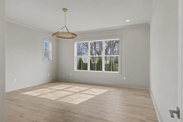 a spacious bathroom with a double vanity sink mirror and bathtub