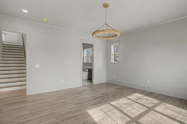 a bathroom with a shower and a glass door