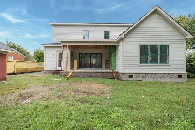 a view of a backyard of the house
