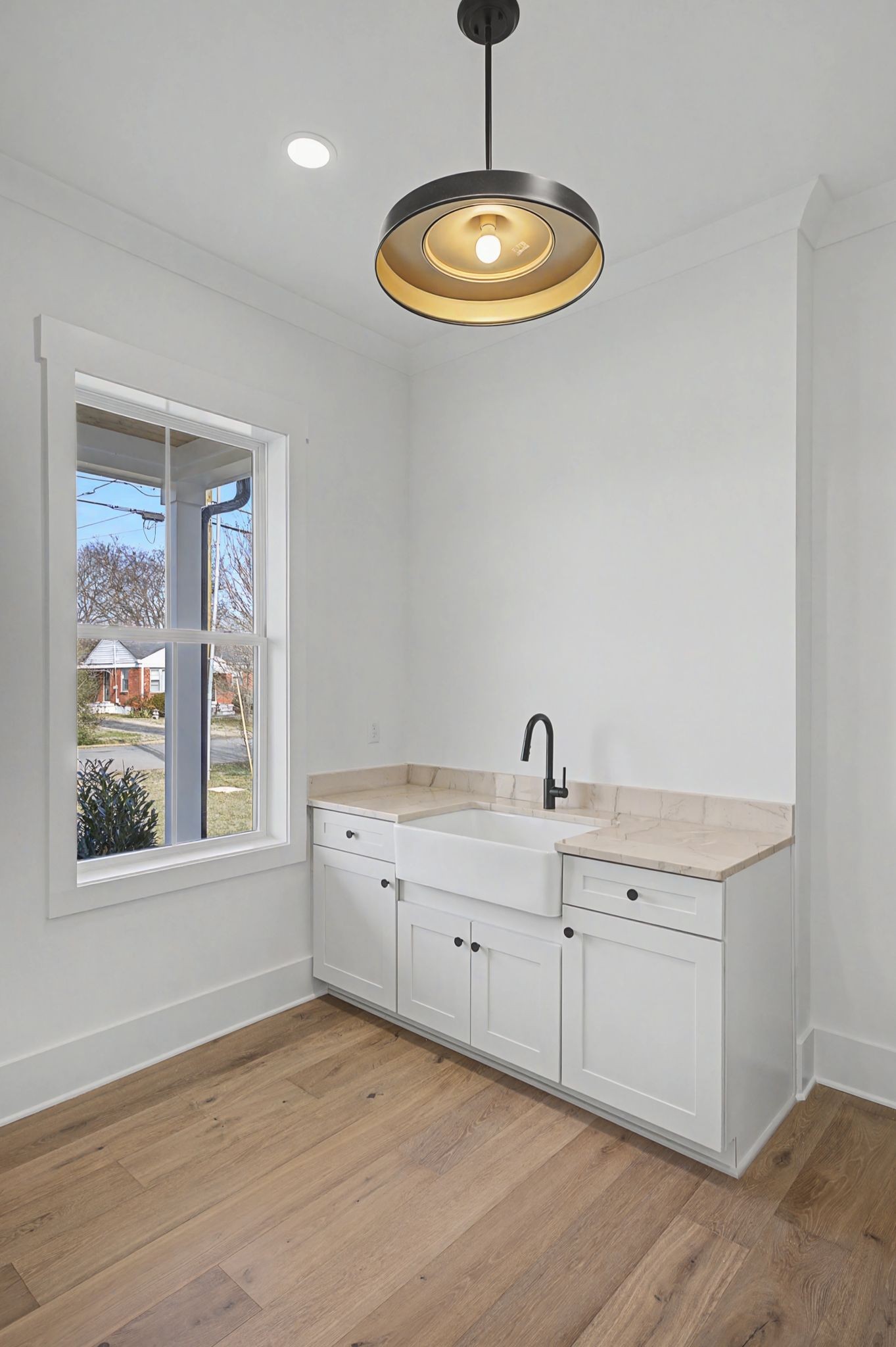 314 James Avenue Franklin, TN 37064 - Photo 27 of 43 a kitchen with a chandelier stainless steel appliances granite countertop a stove a sink and a window