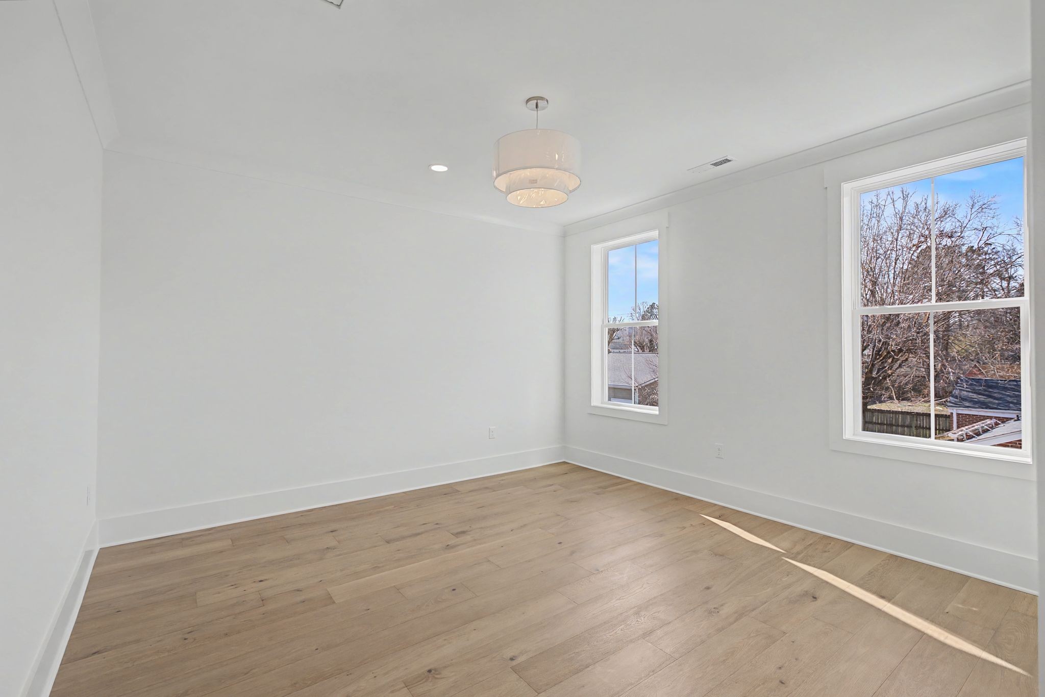 314 James Avenue Franklin, TN 37064 - Photo 33 of 43 an empty room with wooden floor and windows