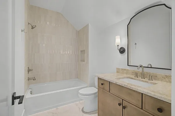 a view of a livingroom with a fireplace and a chandelier
