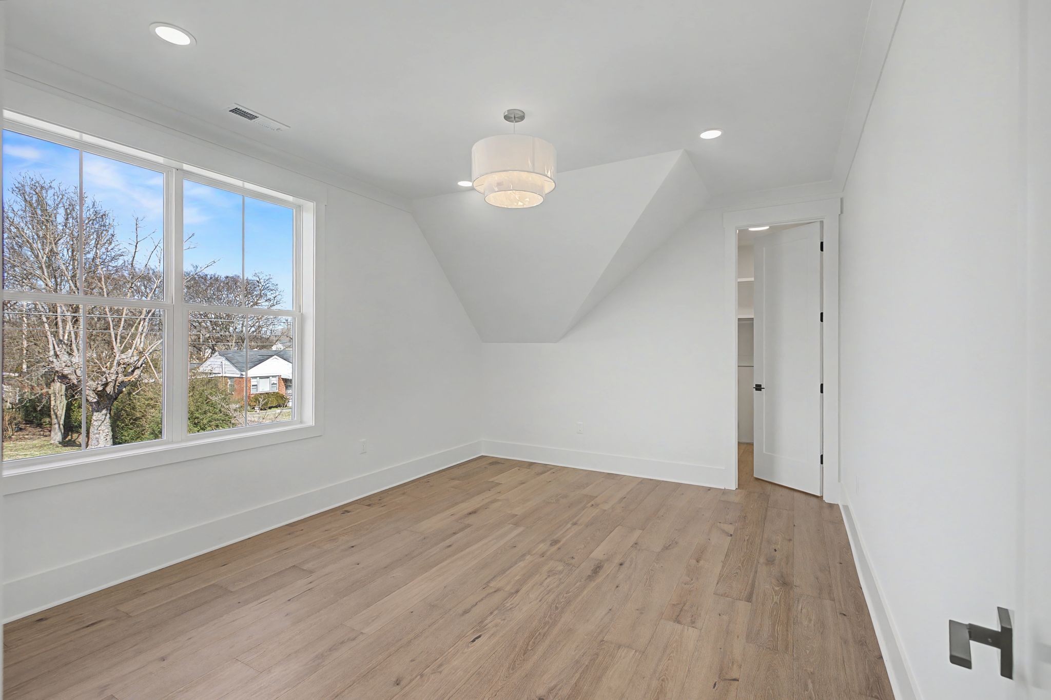 314 James Avenue Franklin, TN 37064 - Photo 36 of 43 an empty room with wooden floor and windows
