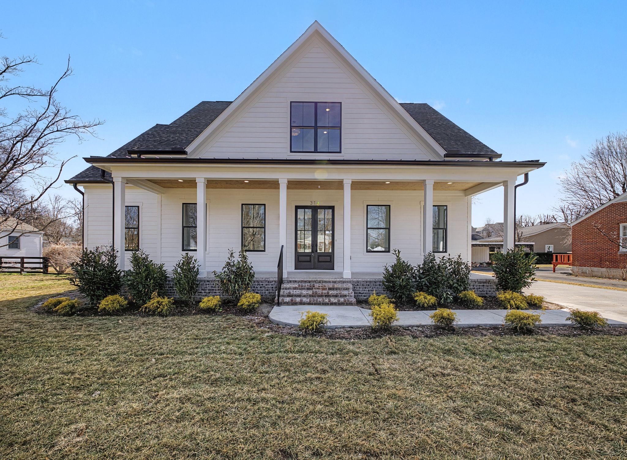 314 James Avenue Franklin, TN 37064 - Photo 4 of 43 a front view of a house with garden