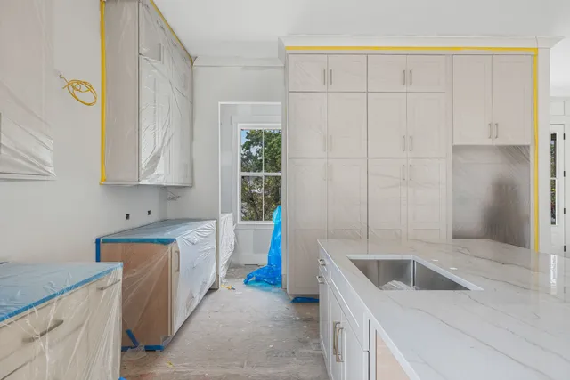 a kitchen that has a sink and a stove