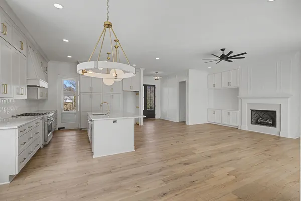 a view of an empty room with a fireplace