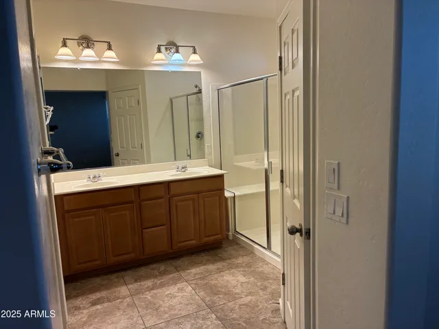 a spacious bathroom with a double vanity sink mirror and