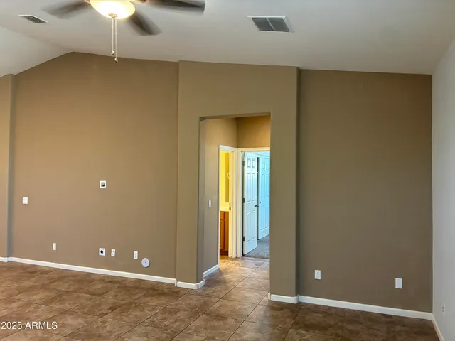 wooden floor and window in an empty room
