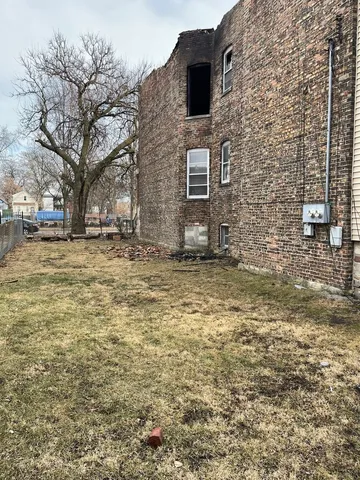 a brick house with a yard