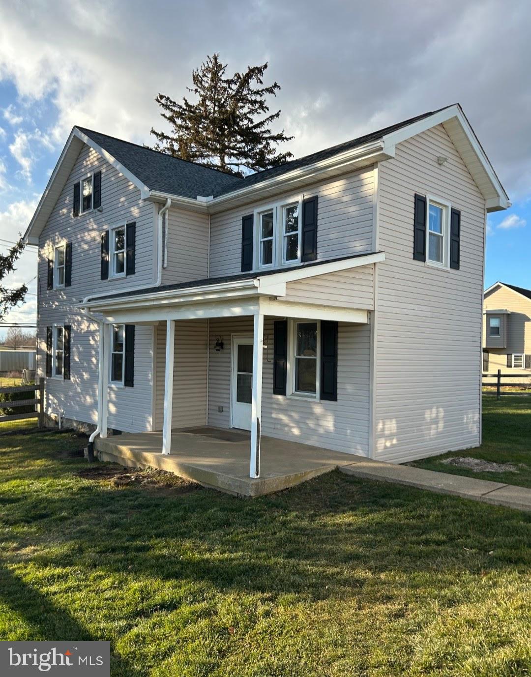 719 Marticville Road Pequea, PA 17565 - Photo 2 of 5 a front view of a house with a yard