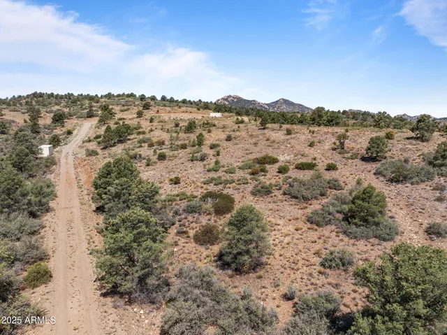 a view of a large body of water with a building in the background