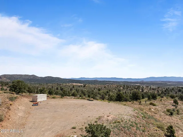 a view of a dry yard with mountain