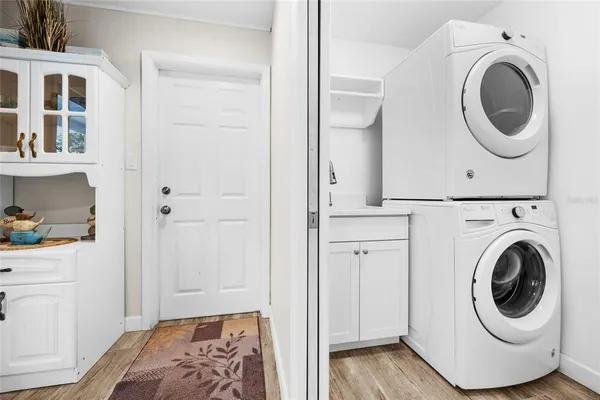 a view of a bedroom with washer and dryer