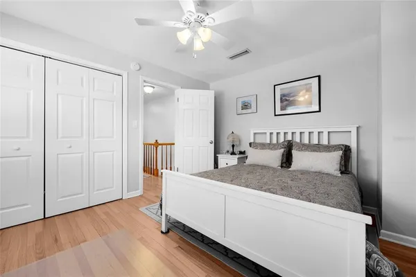 a en suite bathroom with a granite countertop sink and a mirror