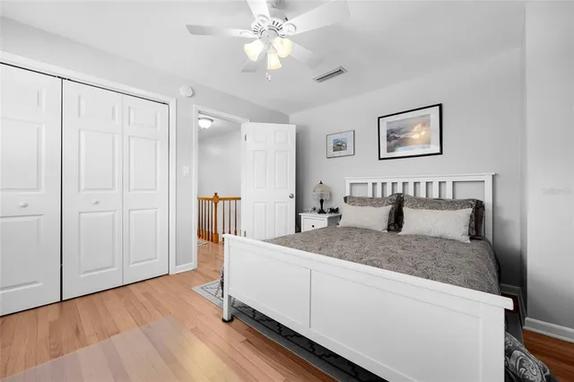 a en suite bathroom with a granite countertop sink and a mirror