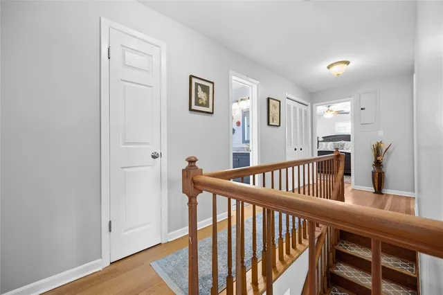 a view of staircase with railing and a window