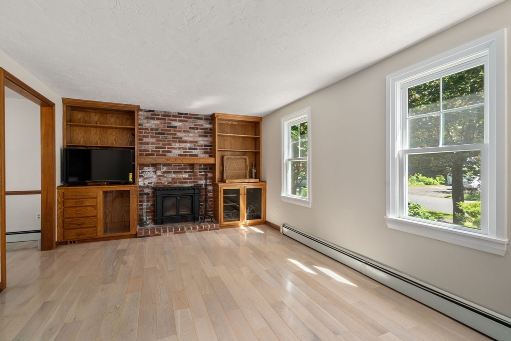15 Mockingbird Lane Maynard, MA 01754 - Photo 13 of 31 a view of a livingroom with a kitchen and a window
