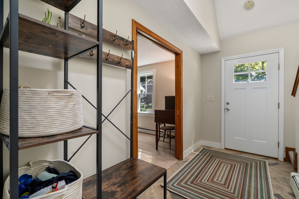 15 Mockingbird Lane Maynard, MA 01754 - Photo 15 of 31 a view of entryway and hall with wooden floor