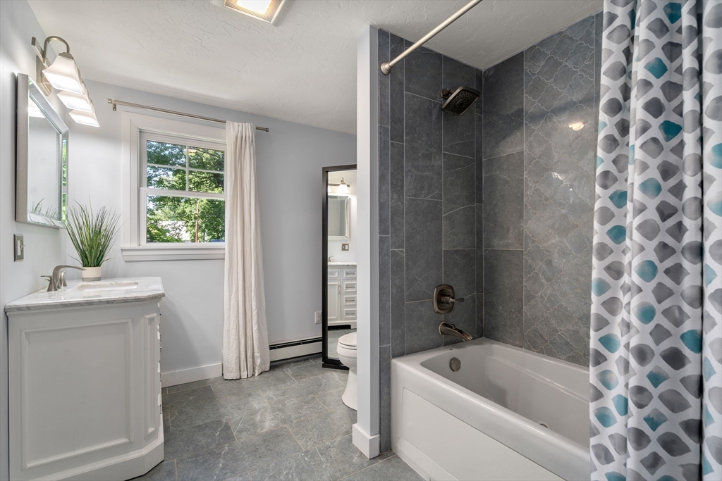 15 Mockingbird Lane Maynard, MA 01754 - Photo 18 of 31 a bathroom with a tub sink and mirror