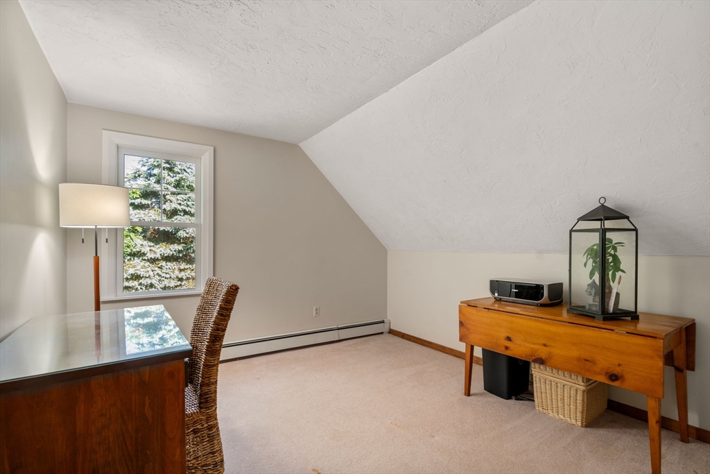 15 Mockingbird Lane Maynard, MA 01754 - Photo 19 of 31 a room with furniture and a window