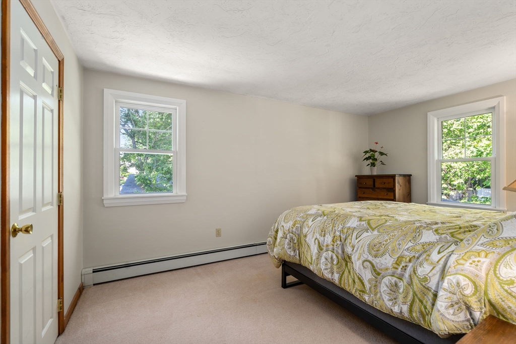 15 Mockingbird Lane Maynard, MA 01754 - Photo 21 of 31 a bedroom with a bed and a window