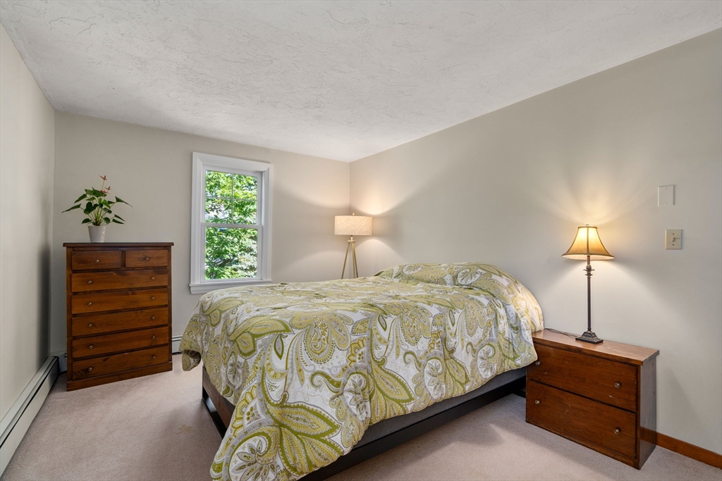 15 Mockingbird Lane Maynard, MA 01754 - Photo 22 of 31 a bedroom with a bed and a closet