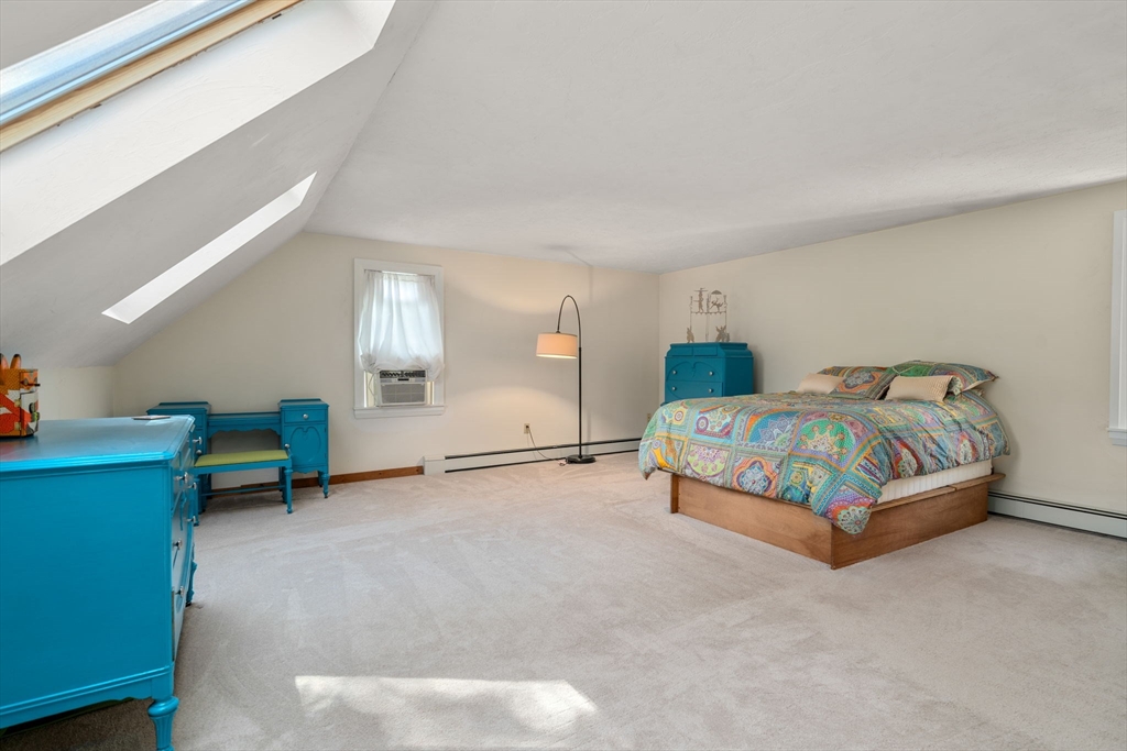 15 Mockingbird Lane Maynard, MA 01754 - Photo 23 of 31 a bedroom with a bed a window and dresser