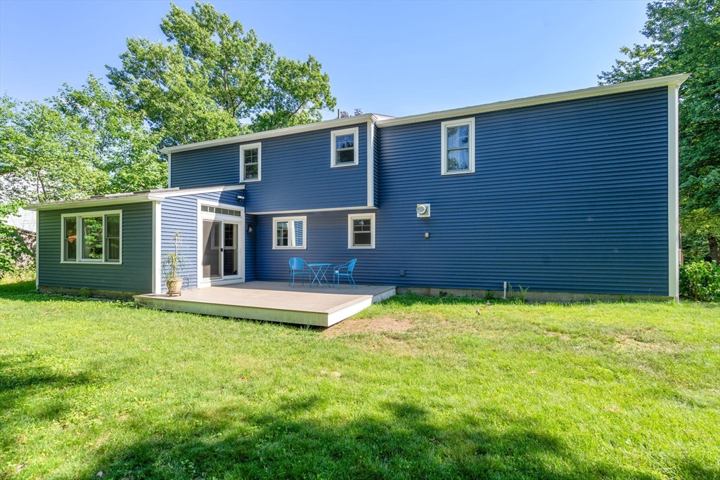 15 Mockingbird Lane Maynard, MA 01754 - Photo 28 of 31 a backyard of a house with yard and tree
