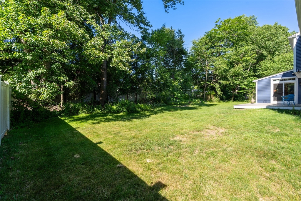 15 Mockingbird Lane Maynard, MA 01754 - Photo 29 of 31 a view of a backyard with large trees