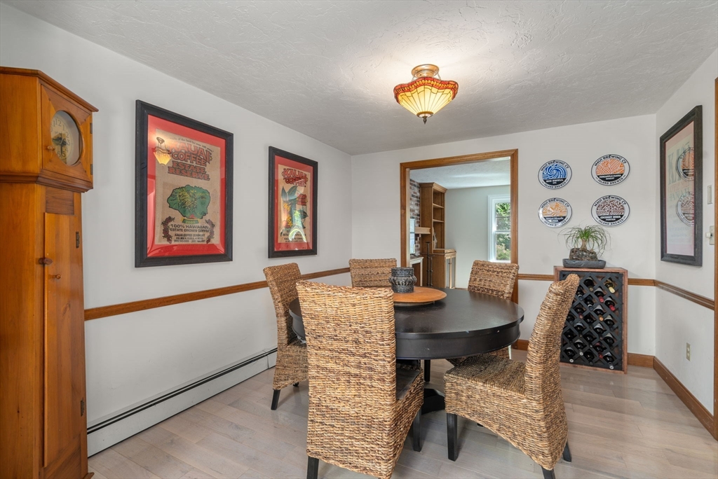 15 Mockingbird Lane Maynard, MA 01754 - Photo 10 of 31 a view of a dining room with furniture and a chandelier